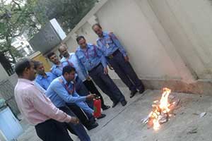 security personnel of pvs performing a fire extinguishing tutorial.