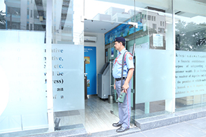security personnel of pvs on duty outside of an office.